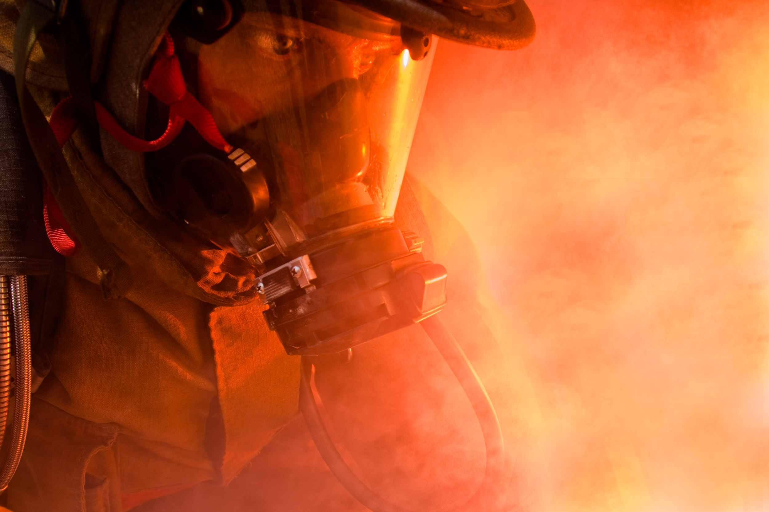 Close portrait of a firefighter in action.