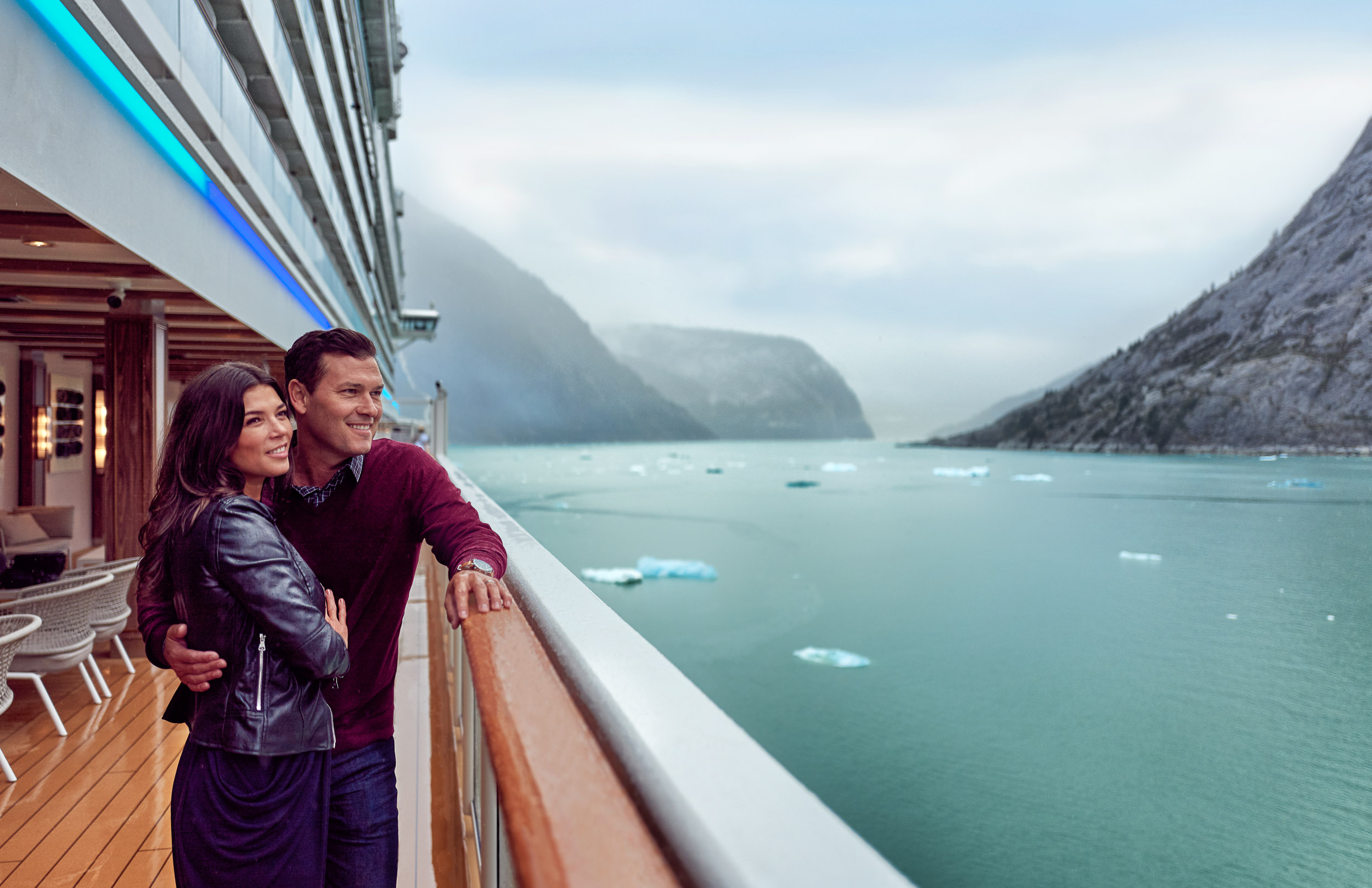 A couple on the deck of a cruise ship in Alaska