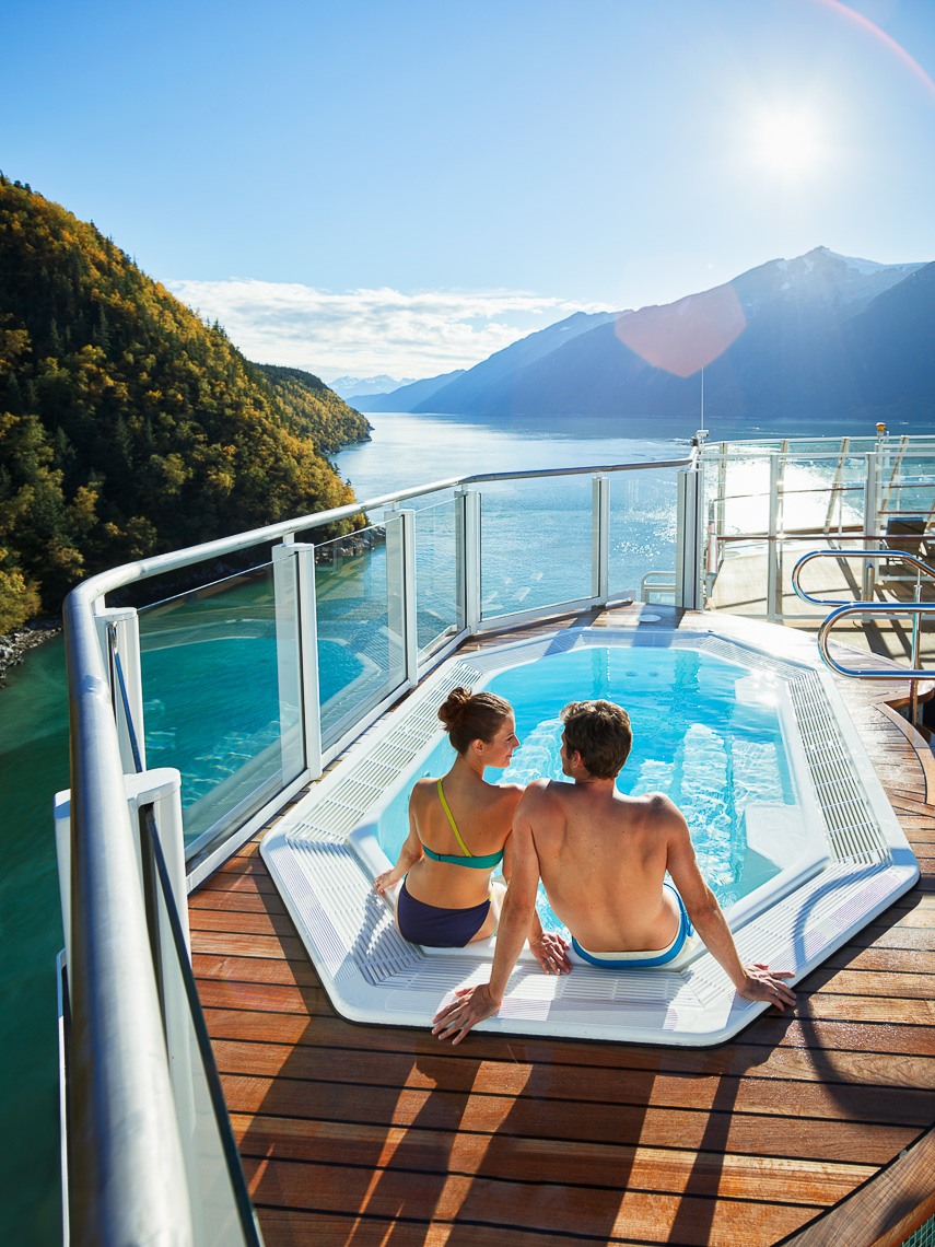 A young couple in the jacuzzi on a cruise ship