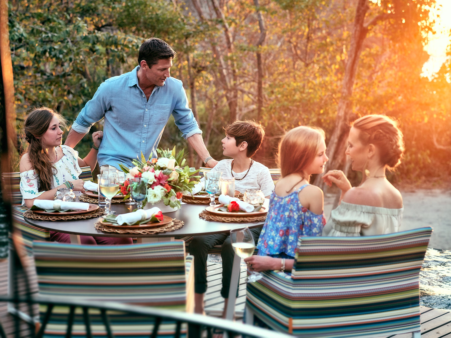 Kevin Steele - a family lifestyle dinner outdoors as the sun sets 