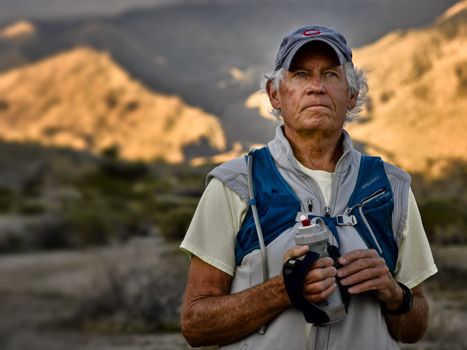 Kevin Steele - portrait of an elderly hiker in the desert at sunrise