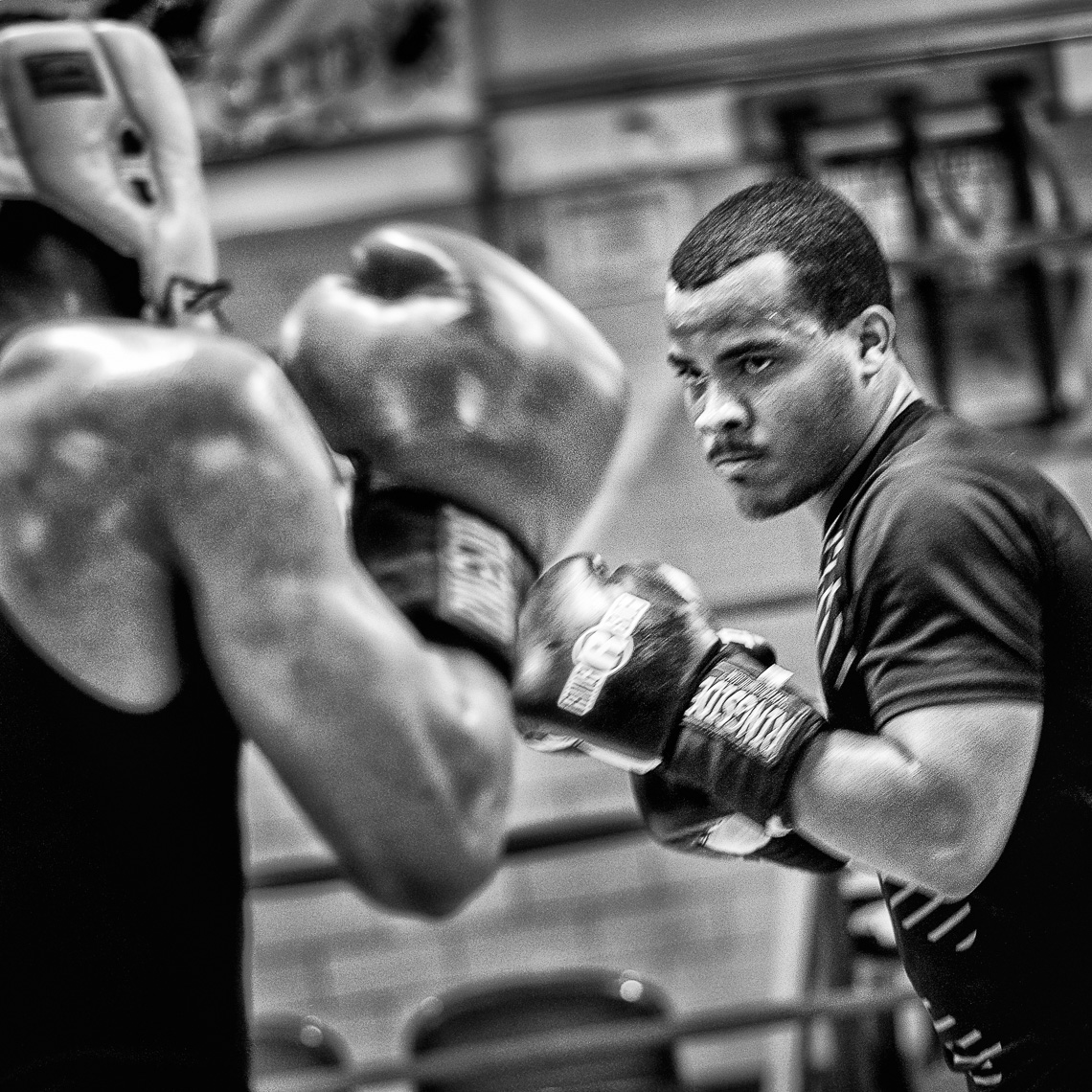 Two boxers training in an urban gym