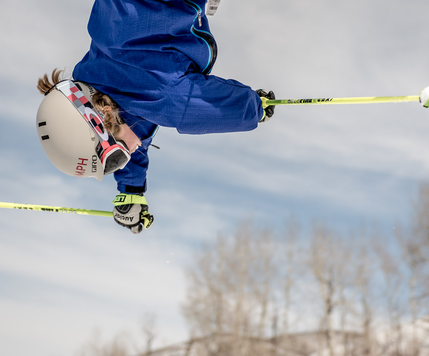 Kevin Steele - a skier performs an acrobatic  jump 