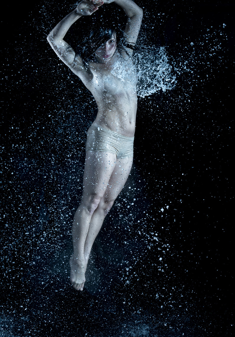 Kevin Steele - studio portrait of falling water over a body
