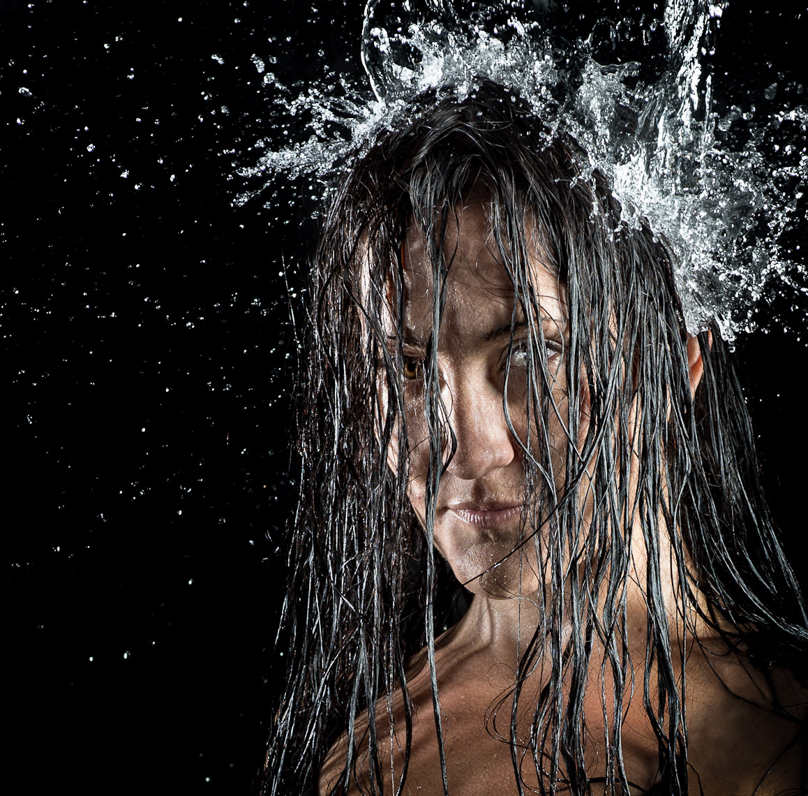 Kevin Steele - close up of water falling down woman