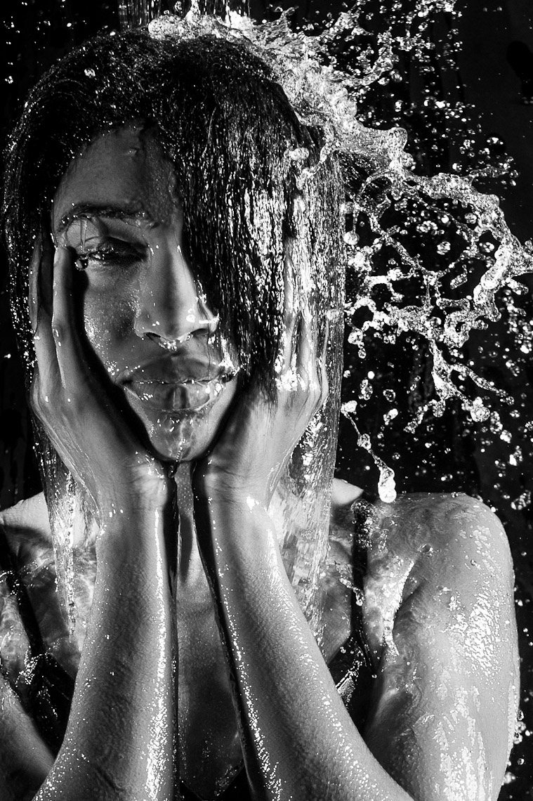Kevin Steele - studio portrait of falling water on a face